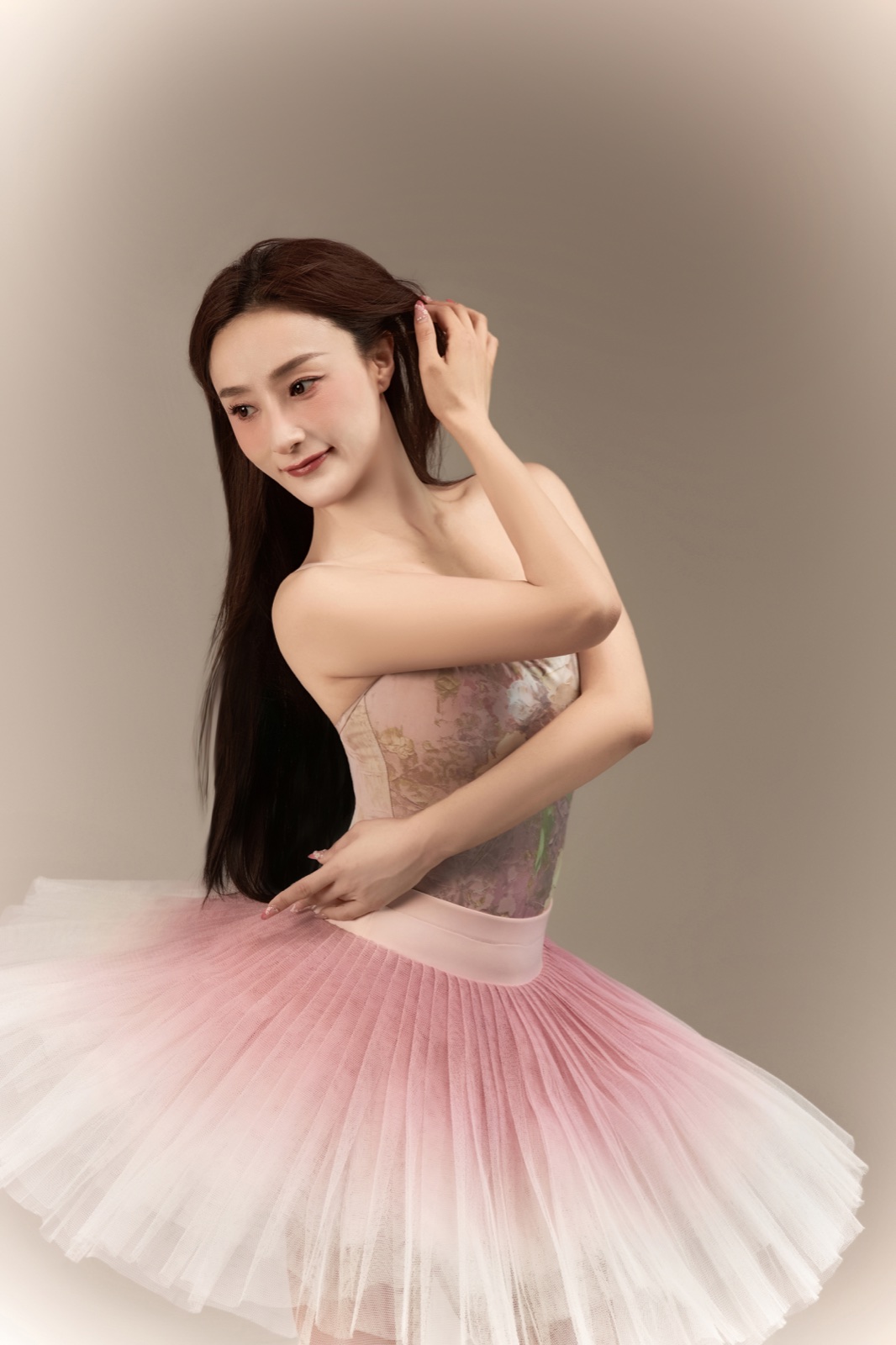 Anna Liu performing ballet in a pale pink tutu